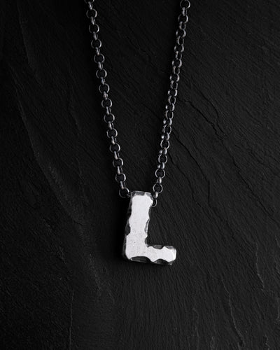 Letter L pendant on a chain