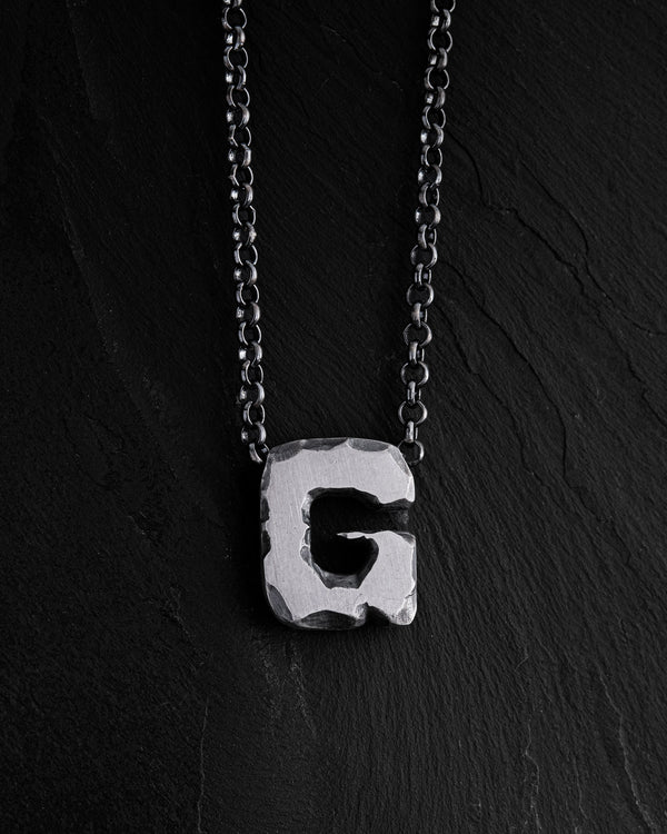 Letter G pendant on a chain