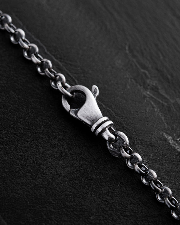 Letter S pendant on a chain